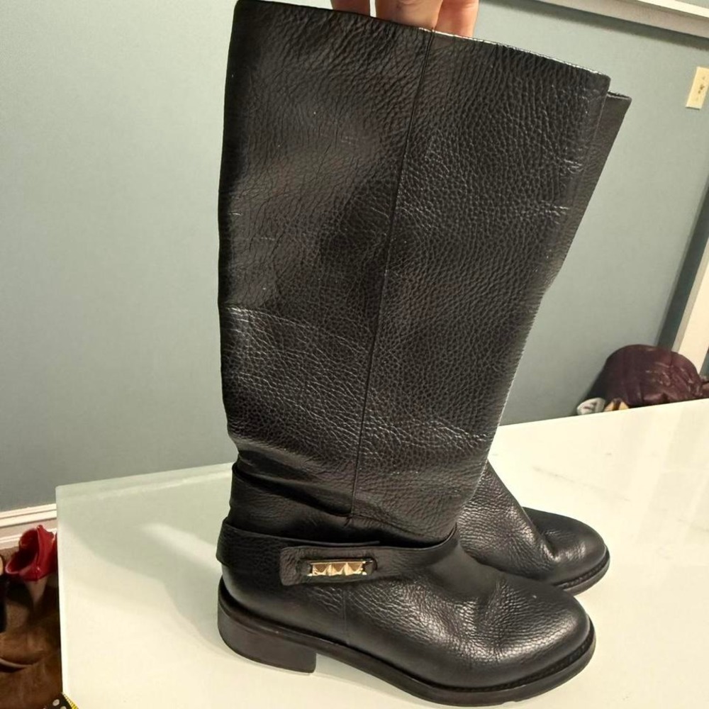 UMA Argentina Black‎ leather knee-high boots with gold buckle detail